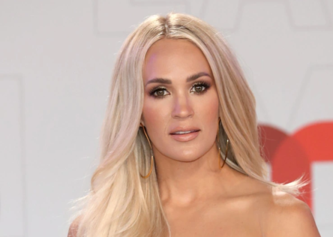 Carrie Underwood suffers awkward tumble during rainy South Carolina concert