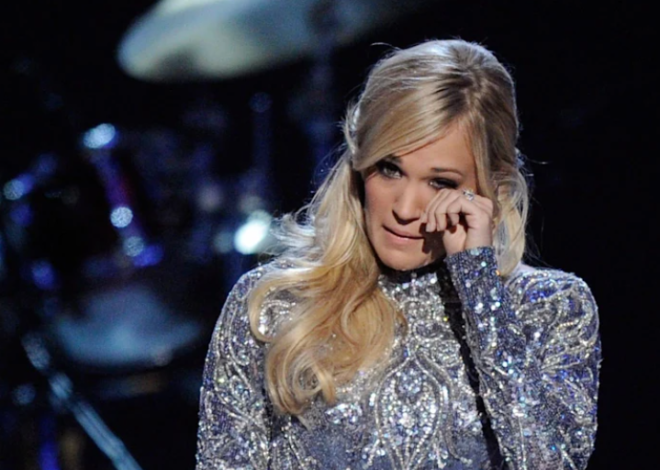 Carrie Underwood wipes away tears as she admits she’s ‘not ok’