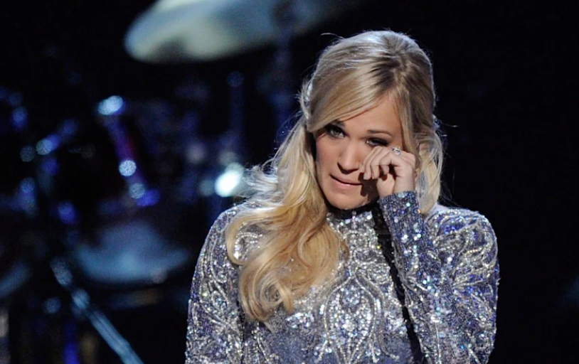 Carrie Underwood wipes away tears as she admits she’s ‘not ok’