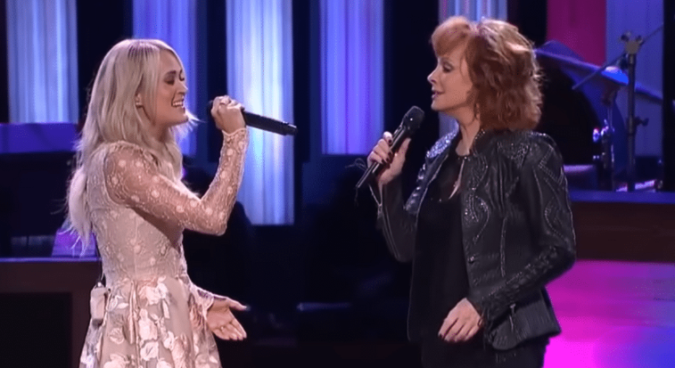 Carrie Underwood Joins Reba For Surprise Performance Of “Does He Love You”