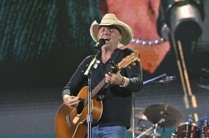 Kenny Chesney could surpass Tim McGraw's chart record in two weeks.