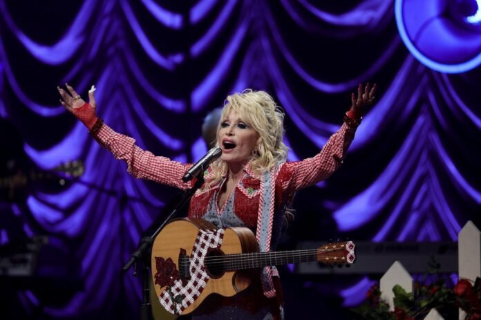 Dolly Parton's nephew requests postponement of restraining order hearing.
