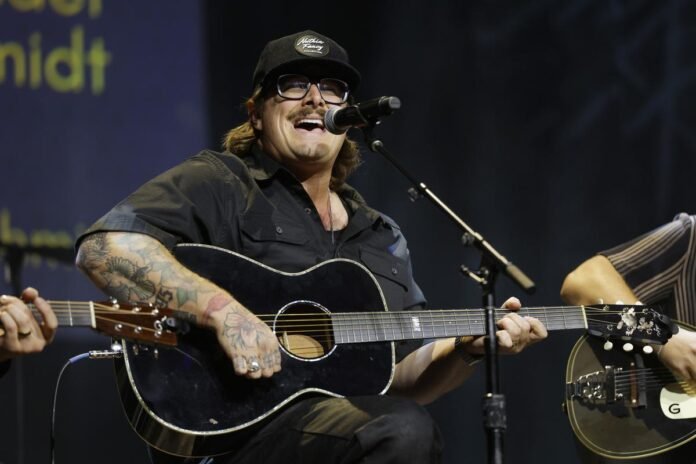 Hardy's 'By God' features authentic country-boy themes. [LISTEN]